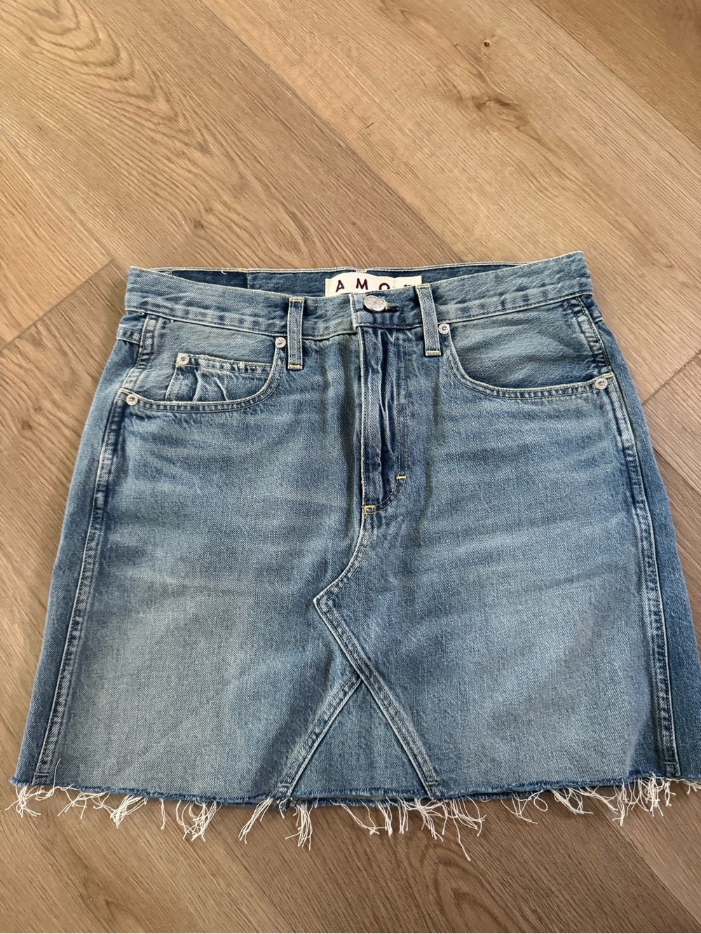 AMO Light Wash Denim Mini Skirt with Frayed Hem